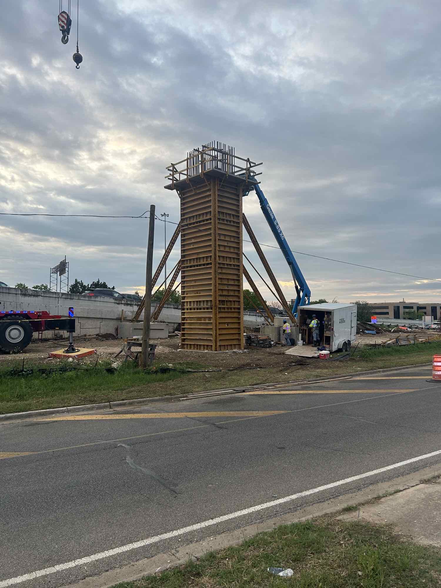 Construction crews building a column for the bridge on US 183.