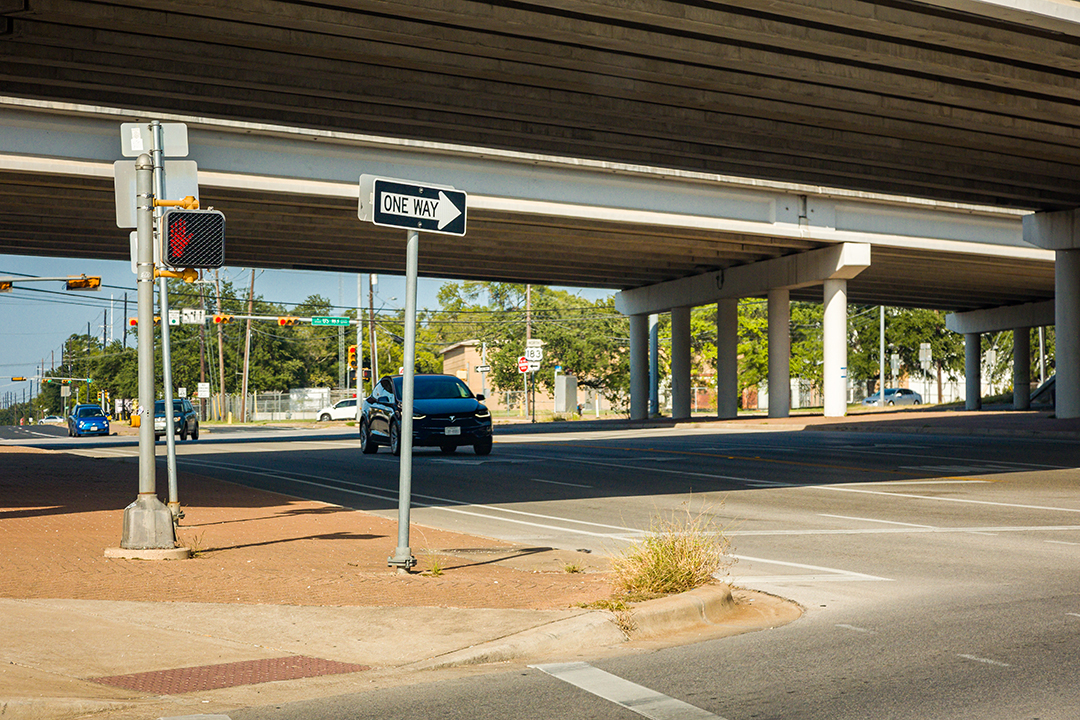 A crosswalk, pedestrian signal and underpass on the existing US 183
