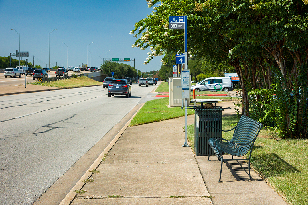 A Capital Metro bus stop and sidewalk on the existing US 183 Frontage Road.