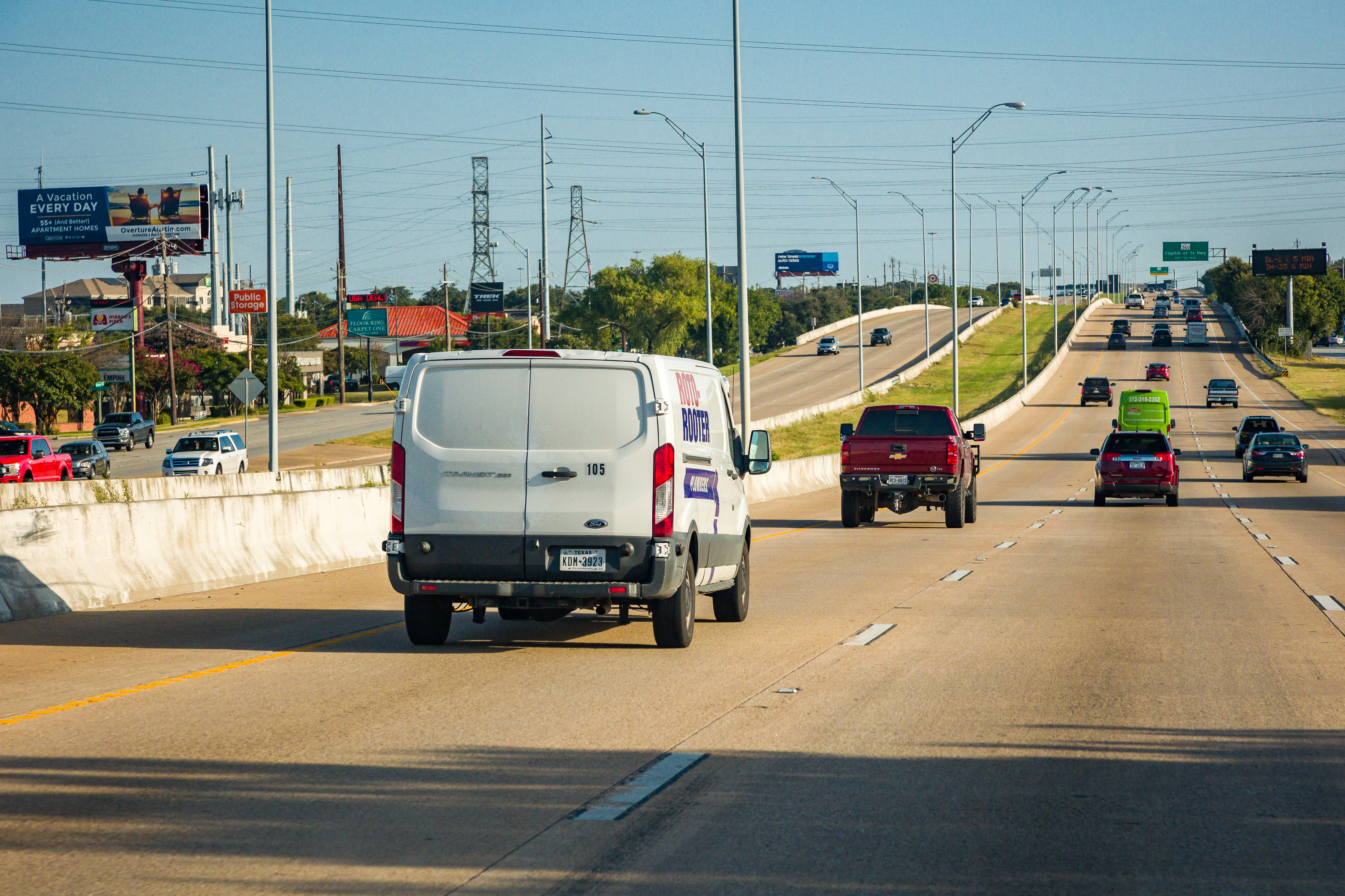 Vehicles driving on three northbound general purpose lanes on US 183.