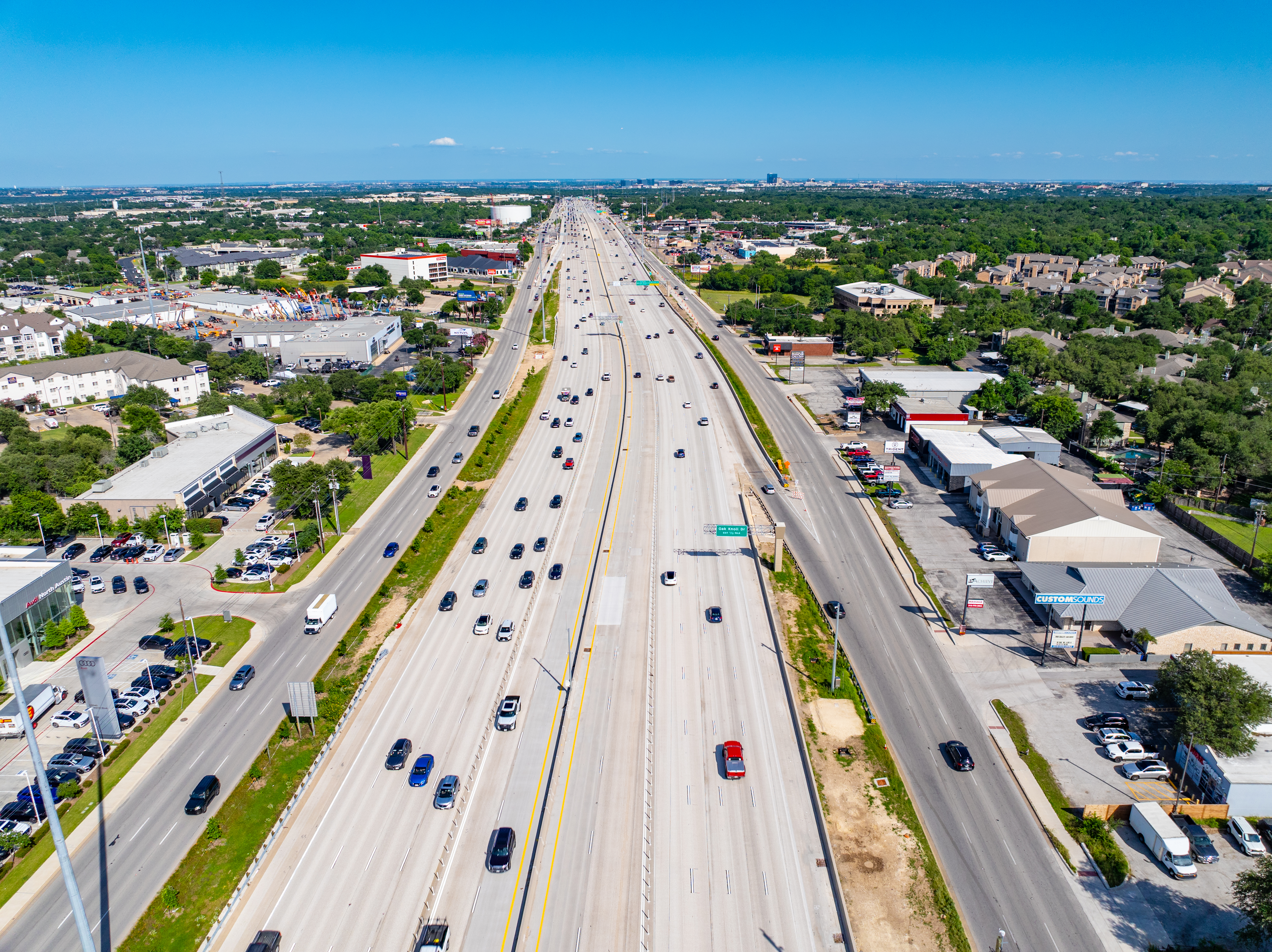 Aerial view of the 183 North Mobility Project showing the northbound and southbound express lanes, mainlanes, and frontage roads near the southbound Oak Knoll Dr. exit.