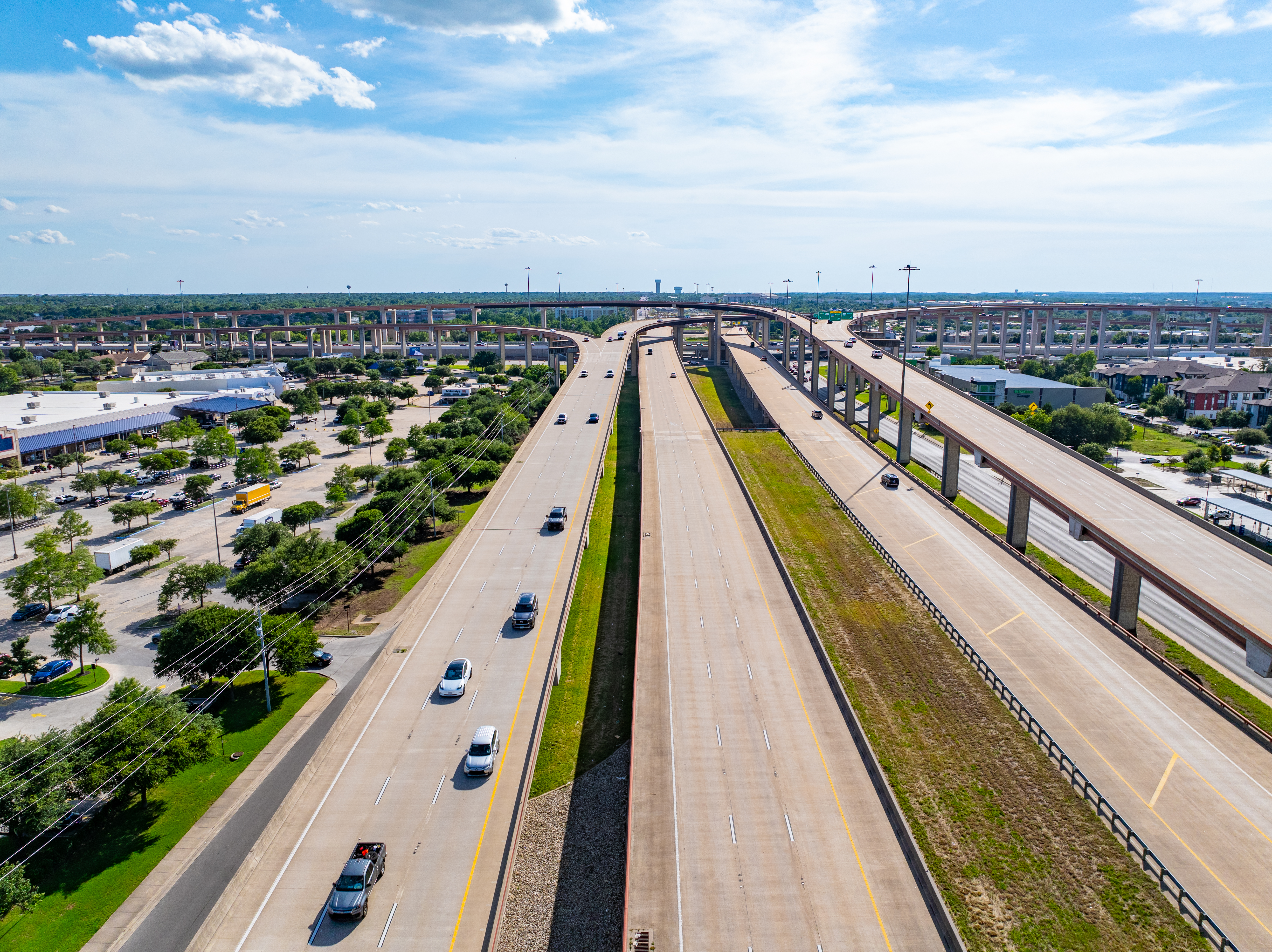 Aerial view of the 183 North Mobility Project near Texas Children's Hospital, looking north along southbound US 183A toward the US 183A and SH 45 interchange, which is visible in the background.