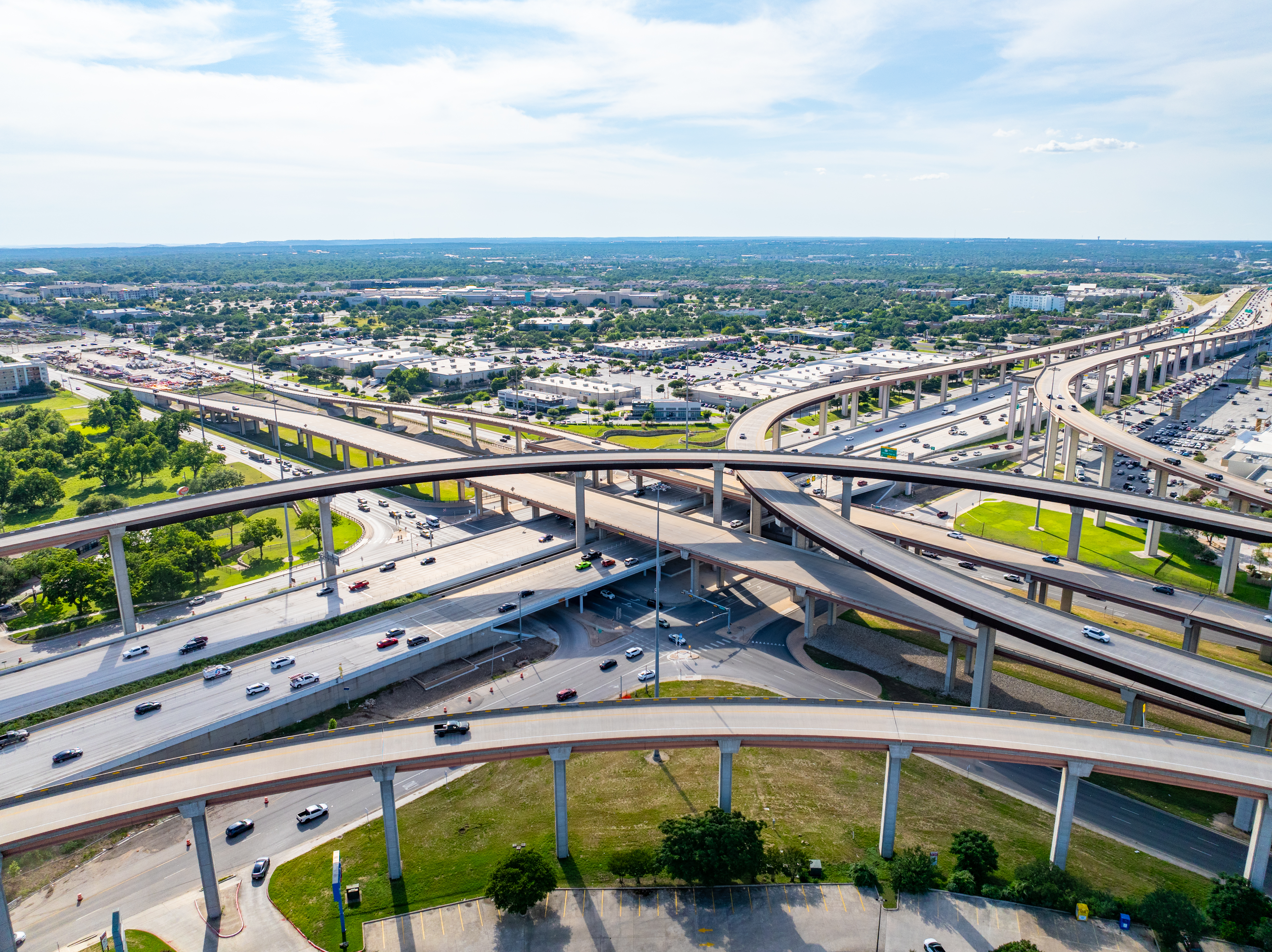 Right angled view of the interchange near Texas Children's Hospital, where US 183, SH 45, and FM 620 converge in northwest Austin. US 183 runs north–south through the center of the image, while SH 45/FM 620 runs east–west.