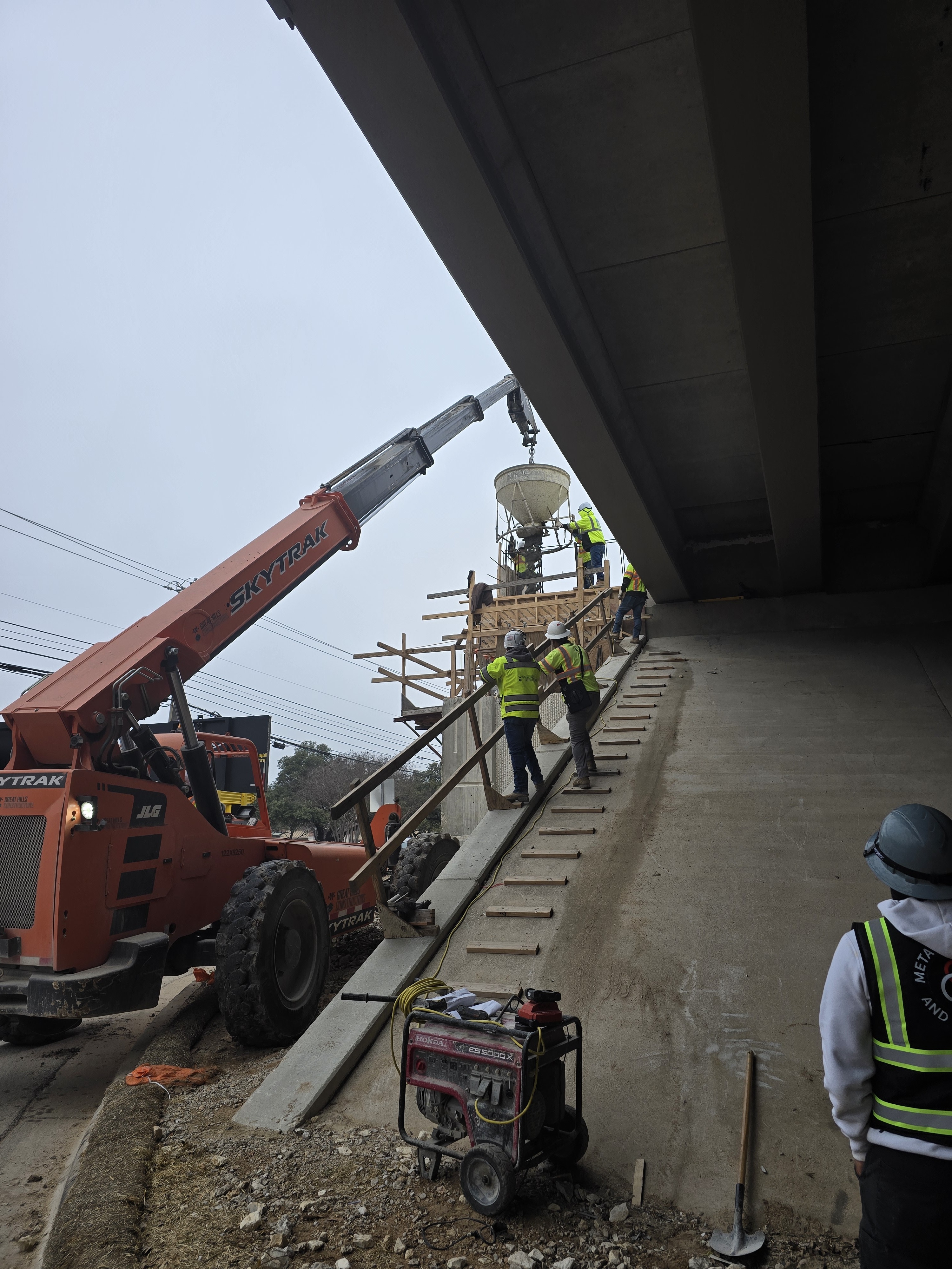Crews pour the bent cap for a back wall.